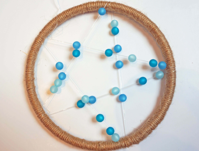 Windspiel: Sternform Windspiel mit Klangstäben